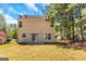 Home exterior with sliding glass door and an ample-sized backyard at 6566 Chestnut Oaks Rdg, Lithonia, GA 30038