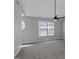 Bright bedroom with vaulted ceiling features new carpeting and a ceiling fan at 6566 Chestnut Oaks Rdg, Lithonia, GA 30038