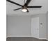The home features a modern fan, neutral carpet and an updated interior door at 6566 Chestnut Oaks Rdg, Lithonia, GA 30038