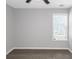 Bright bedroom with a window, ceiling fan, and neutral-colored walls at 6566 Chestnut Oaks Rdg, Lithonia, GA 30038