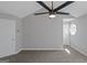 Bedroom with neutral paint and carpeting also features a ceiling fan and white interior doors at 6566 Chestnut Oaks Rdg, Lithonia, GA 30038