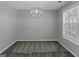 Cozy dining room featuring plush carpet, modern lighting, and a large window, creating an inviting space at 6566 Chestnut Oaks Rdg, Lithonia, GA 30038