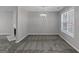 Dining room with plush carpet and a window provides a comfortable space for meals and gatherings at 6566 Chestnut Oaks Rdg, Lithonia, GA 30038