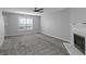 Bright living room with a fireplace, plush carpet, and neutral paint creates an inviting and comfortable space at 6566 Chestnut Oaks Rdg, Lithonia, GA 30038