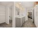 Bright bathroom with double sink vanity, tile flooring and views into the water closet and bedroom at 596 Whitman Lane # 2025, Stockbridge, GA 30281