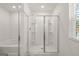 Bathroom featuring a soaking tub and glass-enclosed shower at 596 Whitman Lane # 2025, Stockbridge, GA 30281
