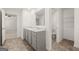 The bathroom features a double sink vanity, tile floors, and toilet room at 596 Whitman Lane # 2025, Stockbridge, GA 30281