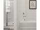 Bathroom featuring a soaking tub, stand-alone shower with glass doors, and decorative wall art at 596 Whitman Lane # 2025, Stockbridge, GA 30281