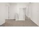 Upstairs hallway features carpeted floors and is brightly lit at 596 Whitman Lane # 2025, Stockbridge, GA 30281