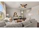 A living room features a comfortable couch, a decorative coffee table, and a ceiling fan at 596 Whitman Lane # 2025, Stockbridge, GA 30281