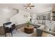 The stylish living room showcases a plush sofa, accent chair, and open-concept design at 596 Whitman Lane # 2025, Stockbridge, GA 30281