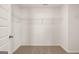 Spacious walk-in closet featuring carpeted floors and white walls with wire shelving for storage at 596 Whitman Lane # 2025, Stockbridge, GA 30281
