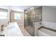 Modern bathroom with glass shower, double sinks, and soaking tub at 250 Hester Rd, Carrollton, GA 30116