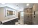Luxurious bathroom featuring a frameless glass shower, double vanity, and designer finishes at 250 Hester Rd, Carrollton, GA 30116