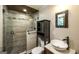 Updated bathroom features decorative tile, frameless shower, vessel sink, and modern fixtures at 250 Hester Rd, Carrollton, GA 30116