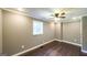 Bedroom featuring ceiling fan, dormer window, and hardwood floors at 250 Hester Rd, Carrollton, GA 30116