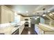 Modern kitchen featuring granite countertops, stainless steel appliances, and white cabinets with dark pulls at 250 Hester Rd, Carrollton, GA 30116