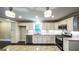 Well-equipped kitchen with white cabinets, stainless appliances, and granite counters at 250 Hester Rd, Carrollton, GA 30116