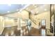 Inviting living room with high ceilings, hardwood floors, and a staircase leading to the upper level at 250 Hester Rd, Carrollton, GA 30116
