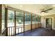 Relaxing screened porch with wooden floors and views of the serene backyard at 250 Hester Rd, Carrollton, GA 30116