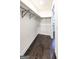 Spacious walk-in closet with dark hardwood floors and adjustable shelving at 250 Hester Rd, Carrollton, GA 30116