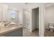 Bathroom featuring double sinks, a soaking tub, glass enclosed shower, and tile floors at 592 Whitman Ln # 2024, Stockbridge, GA 30281