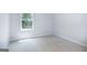 Carpeted bedroom showcasing natural light and a backyard view at 592 Whitman Ln # 2024, Stockbridge, GA 30281