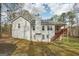 The backyard features a deck, grass, and mature trees at 75 Bretts Bnd, Sharpsburg, GA 30277