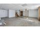 Spacious unfinished basement with concrete floor and wooden staircase at 75 Bretts Bnd, Sharpsburg, GA 30277