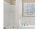 Bathroom features include a shower, garden tub, and large window at 75 Bretts Bnd, Sharpsburg, GA 30277