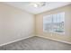 Bedroom features include carpet, neutral walls, and a window for natural light at 75 Bretts Bnd, Sharpsburg, GA 30277