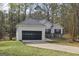 Charming single story home boasts an attached garage and well-maintained landscaping at 75 Bretts Bnd, Sharpsburg, GA 30277