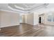 Bright and airy living room features a tray ceiling and hardwood floors at 75 Bretts Bnd, Sharpsburg, GA 30277