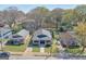 Aerial view of a charming home with a well-manicured lawn and driveway, surrounded by lush greenery at 988 Allene Sw Ave, Atlanta, GA 30310