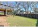 Lush backyard featuring a covered deck area, a hammock, and ample space for outdoor activities at 988 Allene Sw Ave, Atlanta, GA 30310