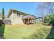 Spacious backyard with a well-maintained lawn, a deck above, and potential for outdoor activities at 988 Allene Sw Ave, Atlanta, GA 30310