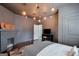 Cozy bedroom with unique light fixtures, fireplace, and neutral tones at 988 Allene Sw Ave, Atlanta, GA 30310