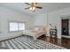 Bright bedroom with large rug, decorative accents, and great natural light at 988 Allene Sw Ave, Atlanta, GA 30310