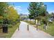 Scenic view of the Atlanta BeltLine trail with lush greenery, street lamps and markers in a park-like setting at 988 Allene Sw Ave, Atlanta, GA 30310