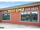 Historic brick building features 'Historic West End Est 1835' sign above large windows in a commercial area at 988 Allene Sw Ave, Atlanta, GA 30310