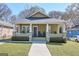 Charming craftsman-style bungalow with a welcoming front porch and well-manicured lawn at 988 Allene Sw Ave, Atlanta, GA 30310