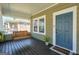 Inviting front porch with a wooden bench swing, plants, painted wood, and natural light at 988 Allene Sw Ave, Atlanta, GA 30310