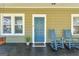 Relaxing front porch with rocking chairs, plants, a welcome mat, and a painted wood floor at 988 Allene Sw Ave, Atlanta, GA 30310