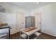 Modern kitchen features stainless appliances, white walls, dark floors, and a movable island at 988 Allene Sw Ave, Atlanta, GA 30310