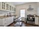Bright kitchen with white cabinetry, granite countertops, and stainless steel appliances at 988 Allene Sw Ave, Atlanta, GA 30310