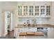 Bright and airy kitchen with white cabinetry, granite counters, and stainless steel dishwasher at 988 Allene Sw Ave, Atlanta, GA 30310