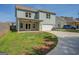 View of backyard with covered patio, two car garage, and a basketball goal at 509 Cowpens Rd, Social Circle, GA 30025