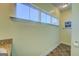 Well lit bathroom with a vanity that features a granite countertop and large windows providing natural light at 509 Cowpens Rd, Social Circle, GA 30025