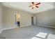 Spacious main bedroom features tray ceilings, neutral walls, plush carpet, and an ensuite bathroom at 509 Cowpens Rd, Social Circle, GA 30025