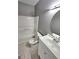 Bathroom showcasing a tub-shower combination, tiled floor, and vanity with sink at 530 Shadowmoore Dr, Riverdale, GA 30274